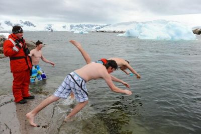 Real polar bear swim - students leap into freezing water