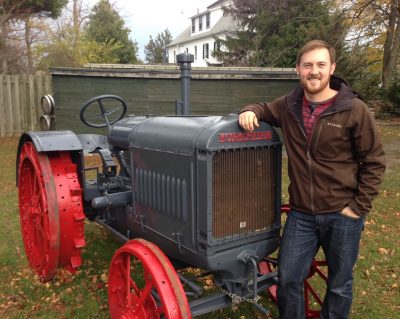 Ian Wereley by a tractor