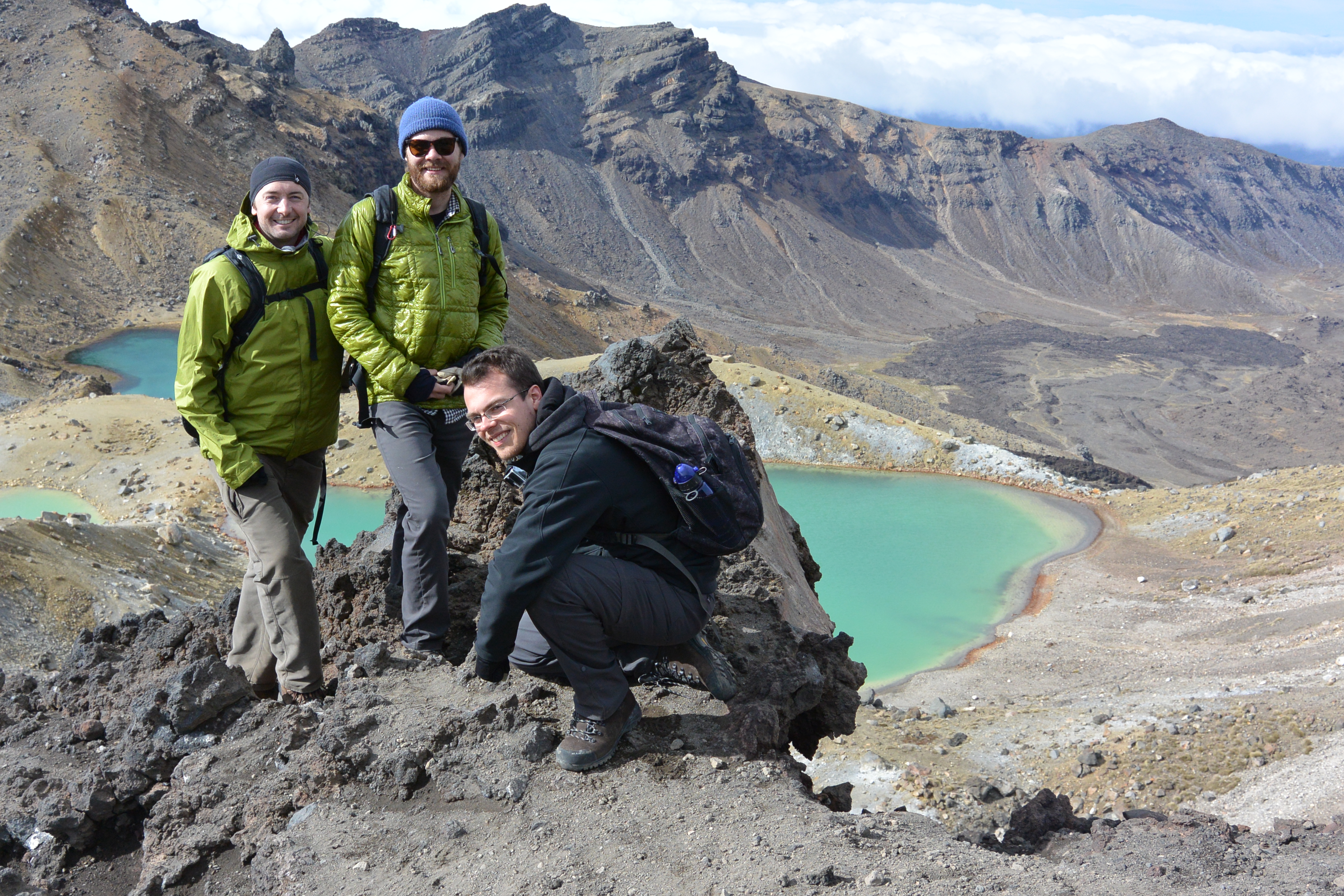  from the summit of the Tongariro Alpine crossing. Loughlin Tuck is on the left, Greenman is in the middle and Michael Thompson is crouching.
