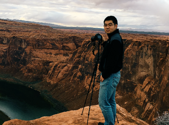 C. Liang standing on top of a mountain