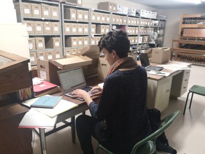 Kate Jordan working in the archives